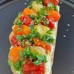 Delicious Hummus Toast with Roasted Cherry Tomatoes - Try It Now!